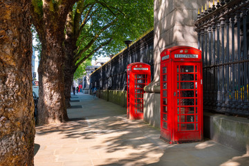 Traditional vintage red K6 telephone kiosk in London, UK