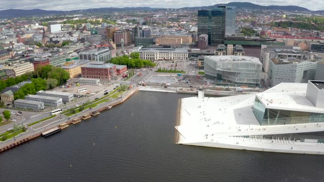 Aerial view on the National Oslo Opera House and Oslo downtown against cloudy sky