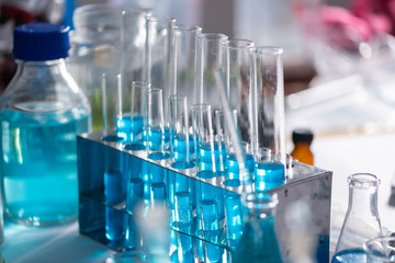 The scientist test the natural product extract, oil and biofuel solution, in the chemistry laboratory.