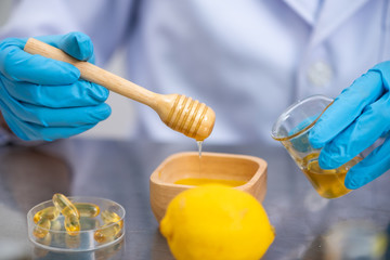 the scientist,doctor, make alternative herb medicine with herbal the organic natural in the laboratory. oil capsule, natural organic skincare and cosmetic