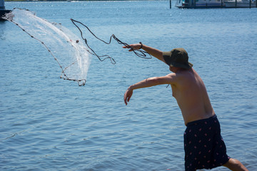 Man that Hand Launches the Fishnet at Sea