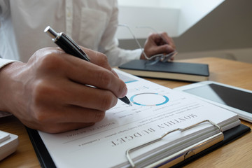 close-up Businessmen  financial  sitting  work  checking documents  using technology