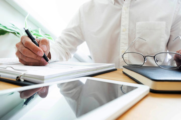 close-up Businessmen  financial  sitting  work  checking documents  using technology