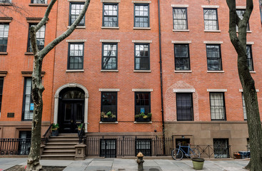 The front of an ornate brownstone building in an iconic neighborhood of Brooklyn in New York City