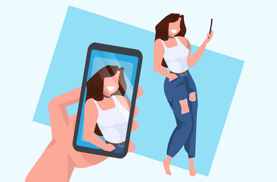 casual woman taking selfie on smartphone camera hand holding cellphone with photo on screen female cartoon character posing flat full length horizontal