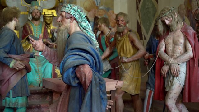 Terracotta sculptures of Jesus Christ on the road to calvary on a biblical character scene representation from a chapel of famous Sacred mountain of Varallo, an Unesco world heritage site