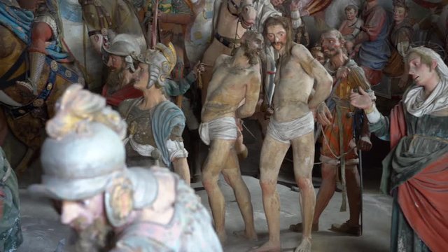Terracotta sculptures of Jesus Christ on the road to calvary on a biblical character scene representation from a chapel of famous Sacred mountain of Varallo, an Unesco world heritage site