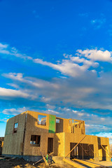 Framework of a house under construction viewed on a bright sunny day