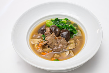 Fried noodle with beef , shiitake and chinese kale in gravy