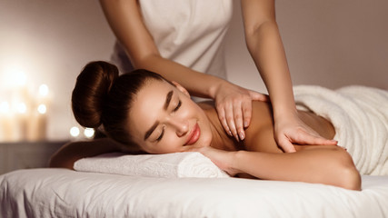 Shoulder Massage. Beautiful Woman Relaxing In Health Spa