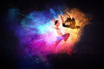 Obraz na płótnie Canvas Young modern ballet dancers in a jump. Mixed media