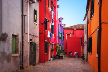Fototapeta premium Burano street, Venice, Italy. Painted colorful houses in Burano island