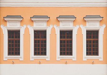 classical background of an old building with a usual row of Windows from Moscow, Russia