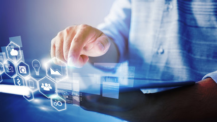 businessman  working with tablet modern technology  with social media icons on screen
