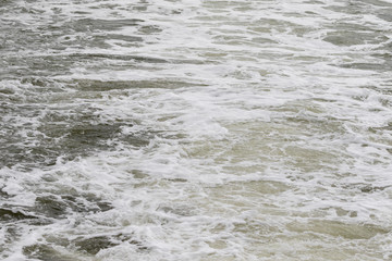 Small waves behind fast driving boat on the north sea 