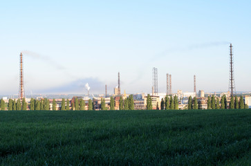 The ruins of the plant, the unfinished construction of a supermarket. Metal construction of the construction site on the background of the landfill.