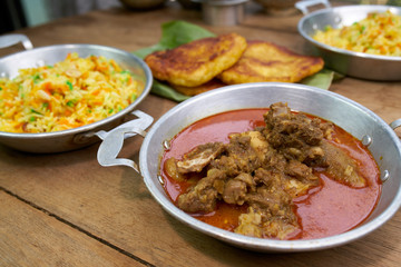 Red Goat Curry on wood table