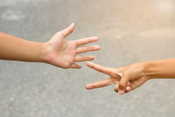 Close-up pictures of hands on a blurred background.