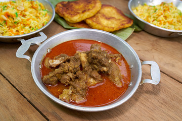Red Goat Curry on wood table