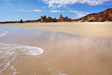 untouched rugged coastline lined by the heavenly blue Indian ocean