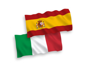 National vector fabric wave flags of Italy and Spain isolated on white background. 1 to 2 proportion.