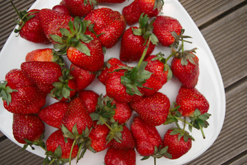 Red washed strawberry on a plate
