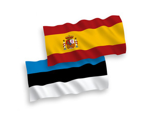 National vector fabric wave flags of Estonia and Spain isolated on white background. 1 to 2 proportion.