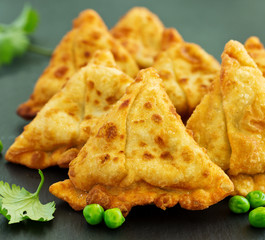 Asian food. Vegetarian samsa (samosas) with tomato sauce