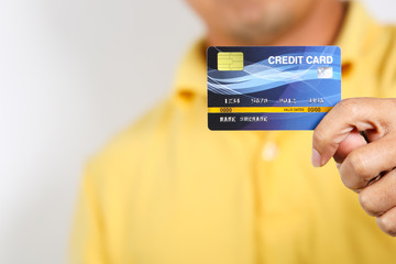 A man showing credit card on white background.
