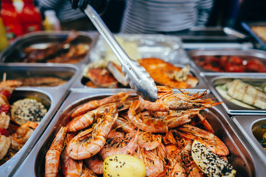 tray with many fried shrimp in the street restaurant