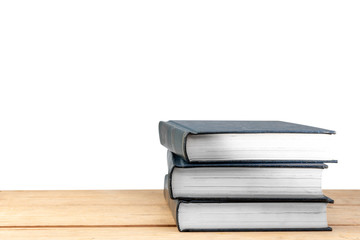 Pile of books on wooden table