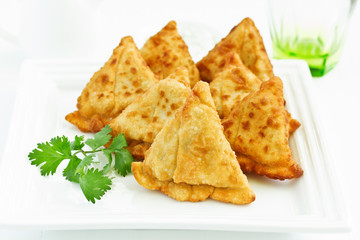 Asian food. Vegetarian samsa (samosas) with tomato sauce