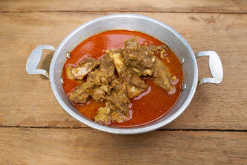 Red Goat Curry on wood table