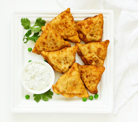 Asian food. Vegetarian samsa (samosas) with tomato sauce