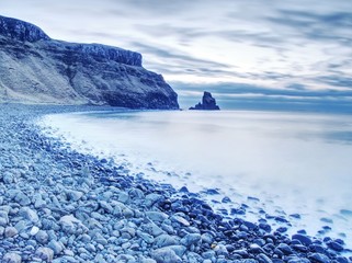 Rocky coast of sea. Slow shutter speed for smooth water level. Visite Talisker Bay