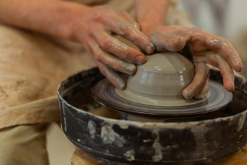 Talented accurate man being professional pottery master