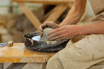 Practiced hard-working guy being an expert in pottery mastery