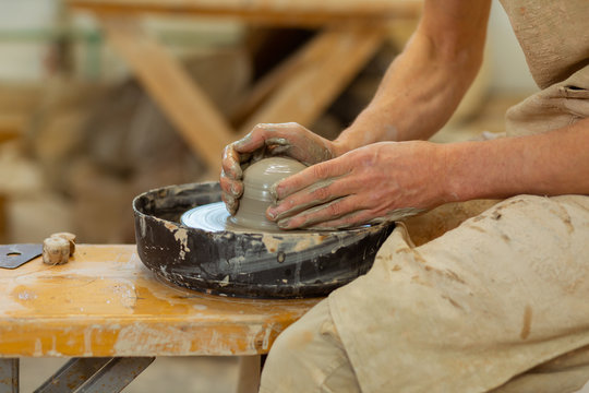 Practiced hard-working guy being an expert in pottery mastery