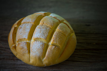 Fresh bread on wood, freshly baked bread on wooden background, traditional bakery concept