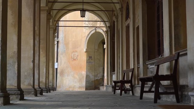 Long Porticos Chapel with windows at the Sacred Mountain of Varallo, a christian devotional complex, a unesco world heritage si in Italy. Zoom out 4k footage