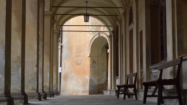 Long Porticos Chapel with windows at the Sacred Mountain of Varallo, a christian devotional complex, a unesco world heritage si in Italy. Panning 4k footage