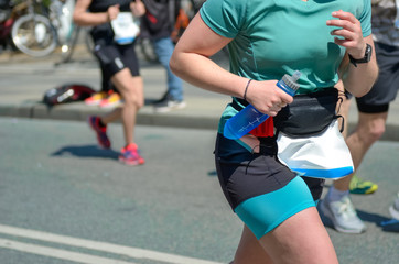 Fototapeta premium Marathon running race, woman runner on road racing, sport competition, fitness and healthy lifestyle concept