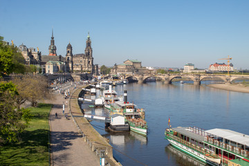 Dresden streets with beautiful architectural masterpieces in the Baroque and Art Nouveau style on a sunny Easter day.