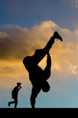 breakdance performer at sunset