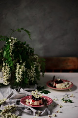 pannacotta with acacia flowers and cherry sauce.