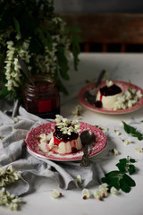 pannacotta with acacia flowers and cherry sauce.