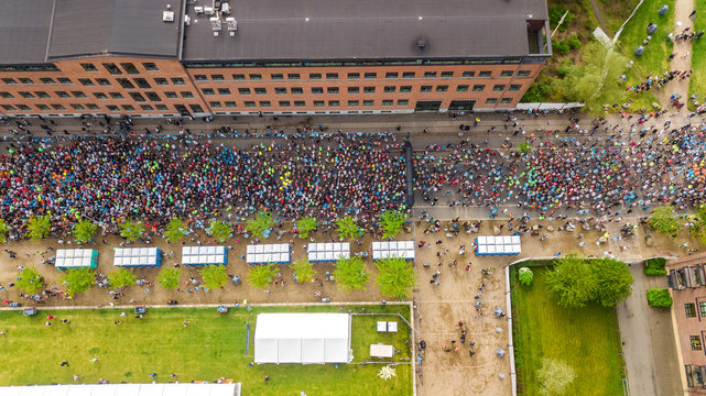 Marathon running race, aerial view of start and finish line with many runners from above, road racing, sport competition, Copenhagen marathon, Denmark