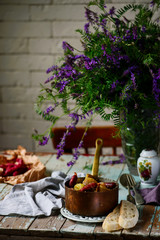 Steamed cabbage with smoked sausage  in iron pan