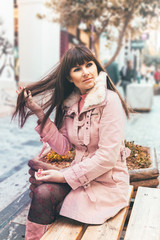 Portrait of a Stylish Pretty Young Woman in Autumn Fashion walking the city, Athens, Greece