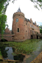 Fototapeta na wymiar Old moated castle in the country